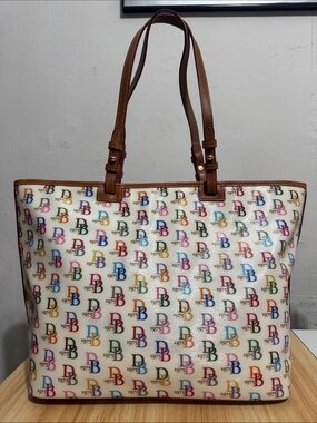 Dooney & Bourke rainbow DB & “1975”